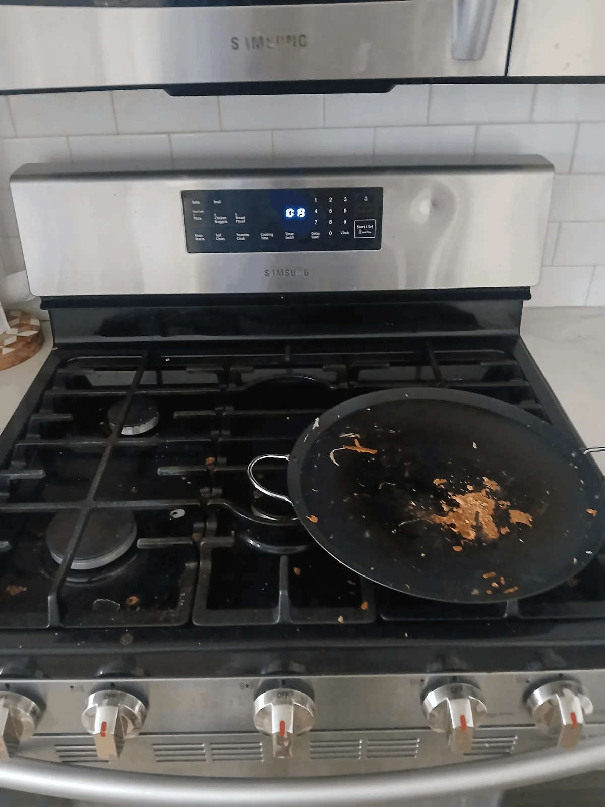 Stovetop before detail cleaning at a Madison client home